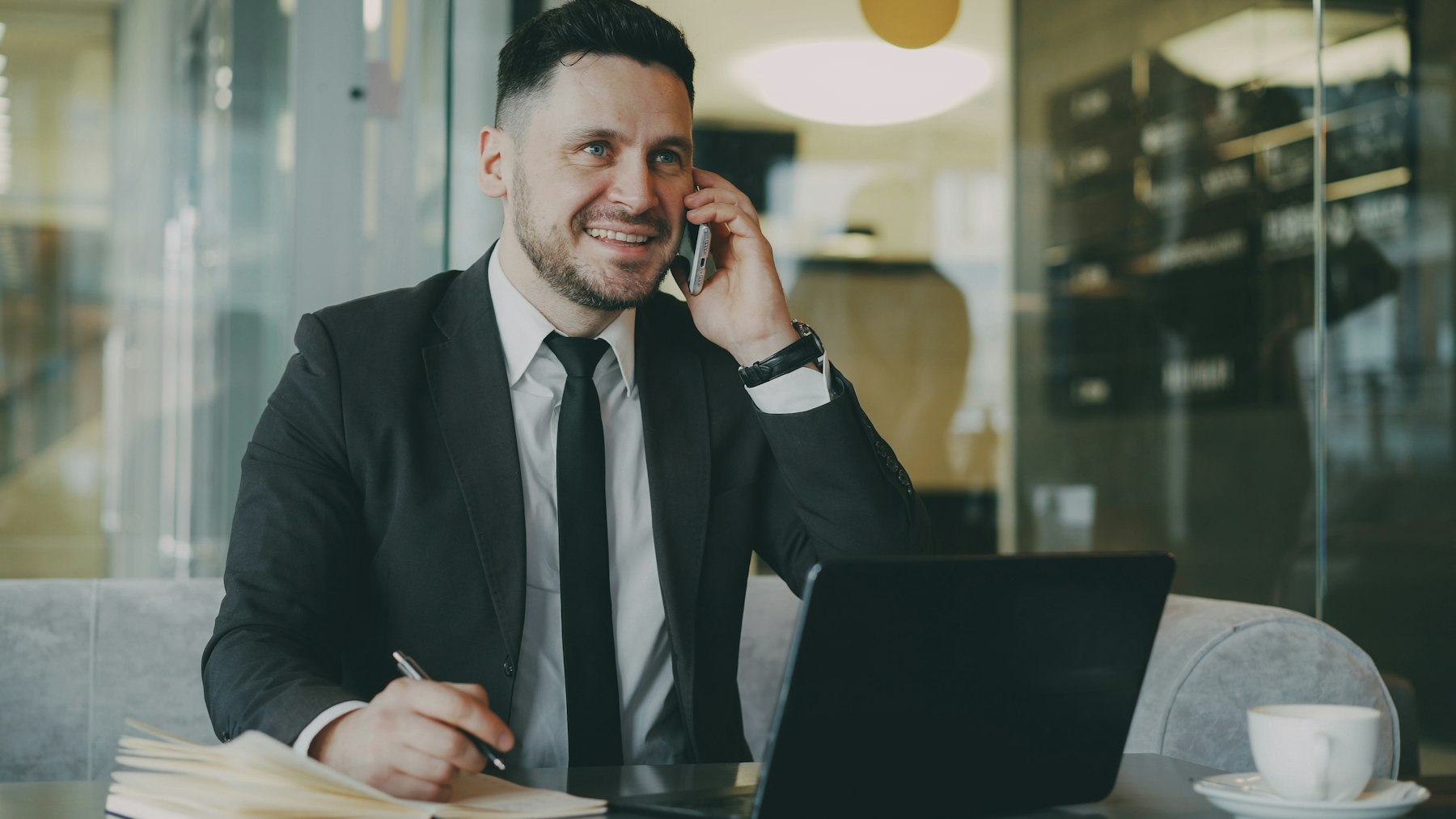 Business owner on the phone at his laptop