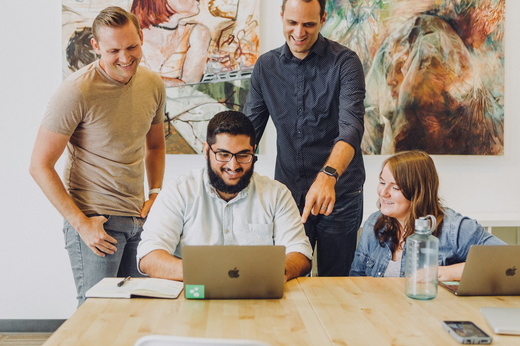 Business team working together around a laptop